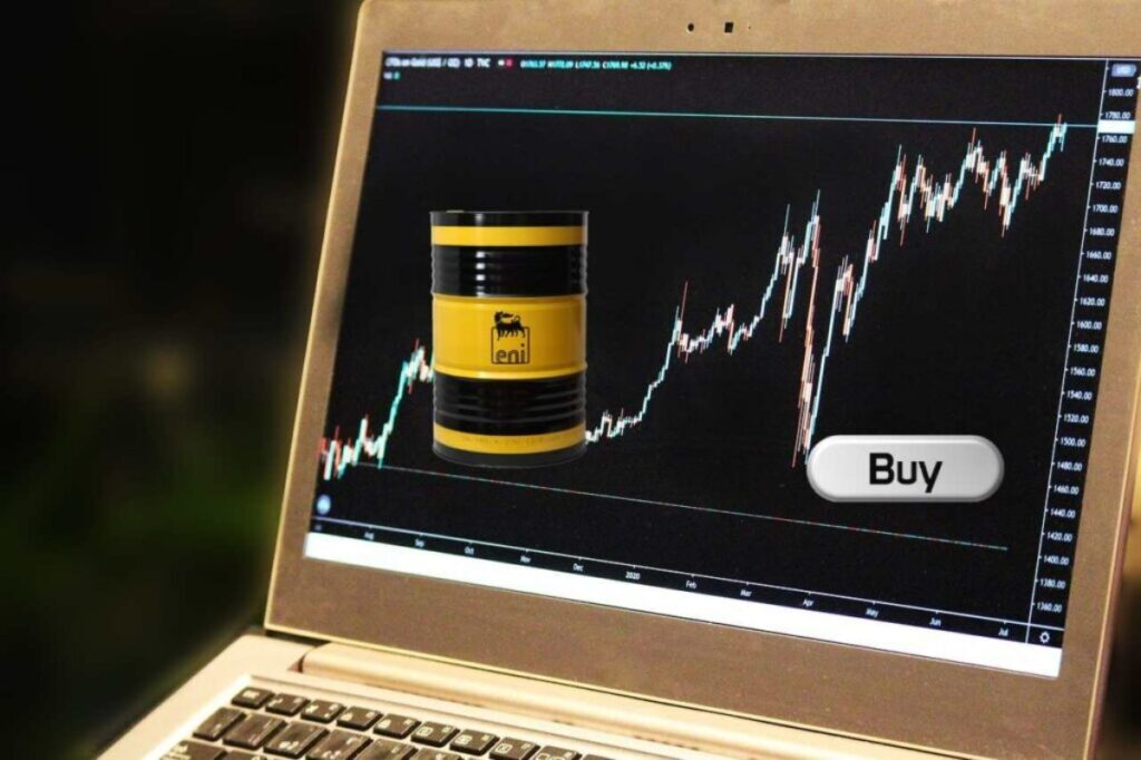 laptop con logo Eni e tasto "buy"