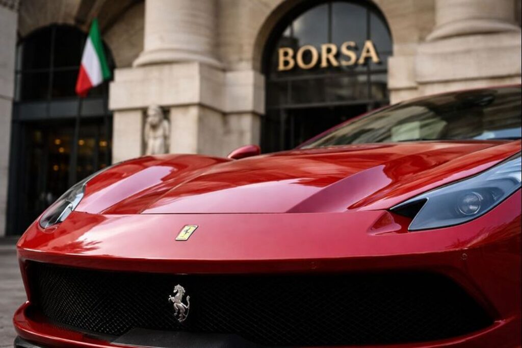 Una Ferrari davanti all'ingresso della Borsa di Milano
