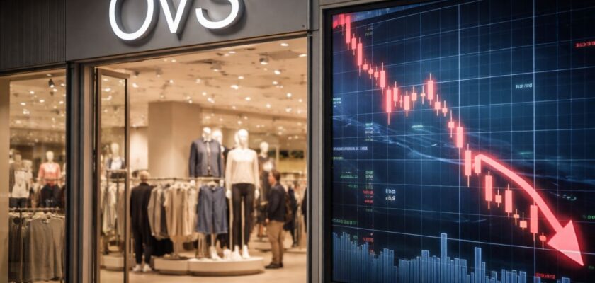 L'entrata di un punto vendita OVS e un grafico finanziario in discesa su uno schermo in primo piano